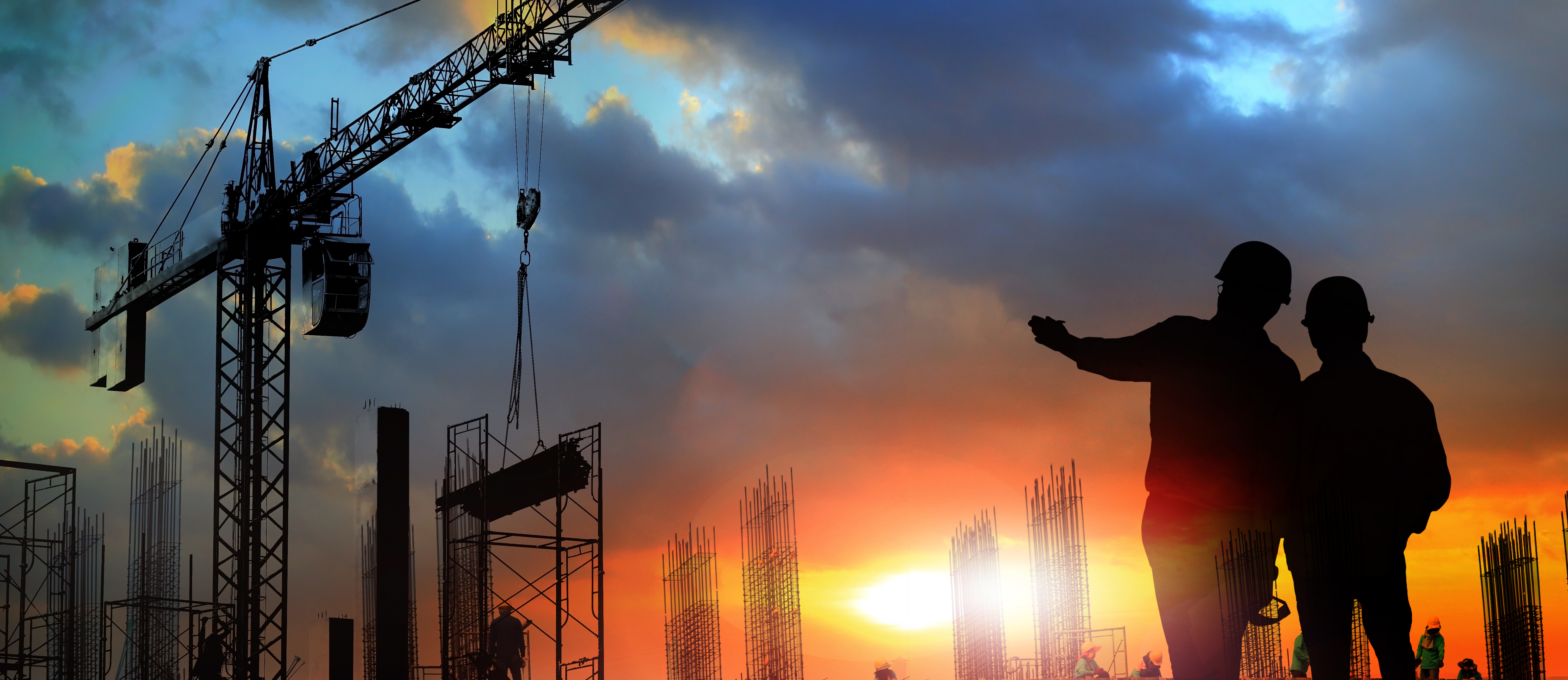 two engineer on working site , engineer and tower cranes at construction site and city background