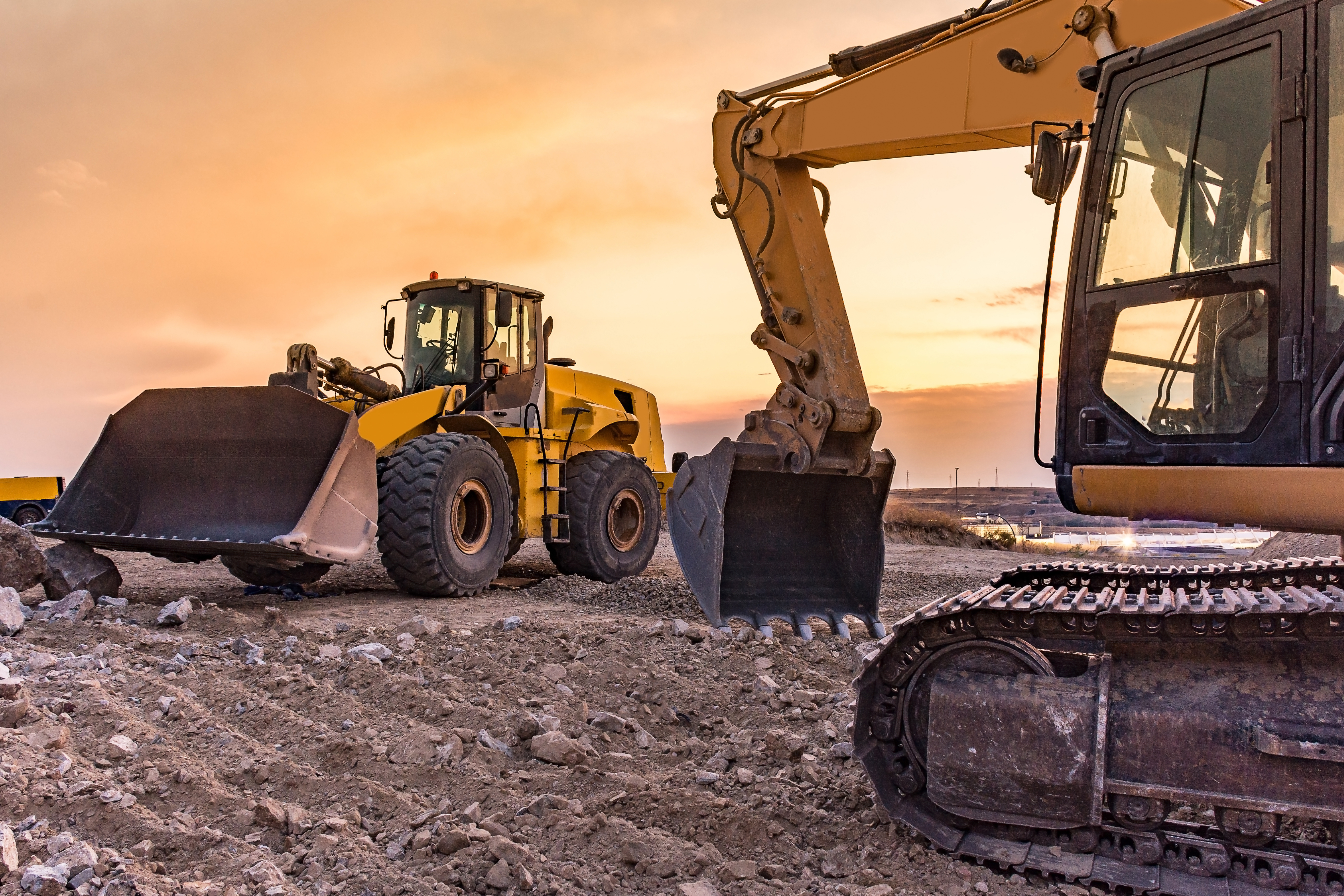 Group of excavator working on a construction site Group of excavator working on a construction site